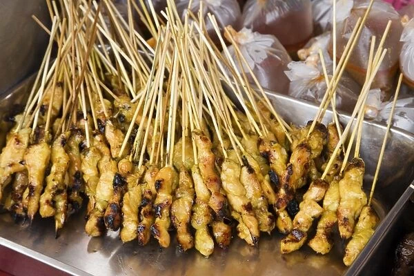 Malaysia, Marang, Chicken on skewers at market stall, close-up