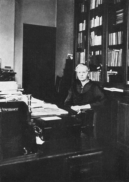 Marie Curie (1867-1934) Polish-born French physicist in 1925 in her office at the Radium Institute