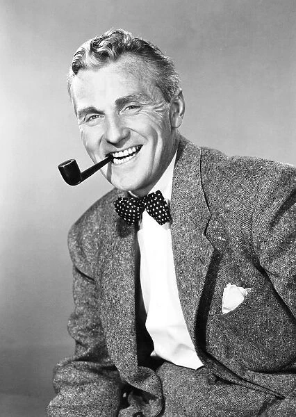 Mature man with bow tie smoking pipe