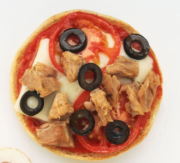 Mini pizza topped with cheese, tomato olives and tuna