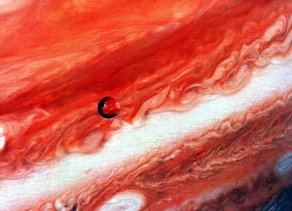 Mosaic of Jupiter and its inner satelite lo. NASA photograph
