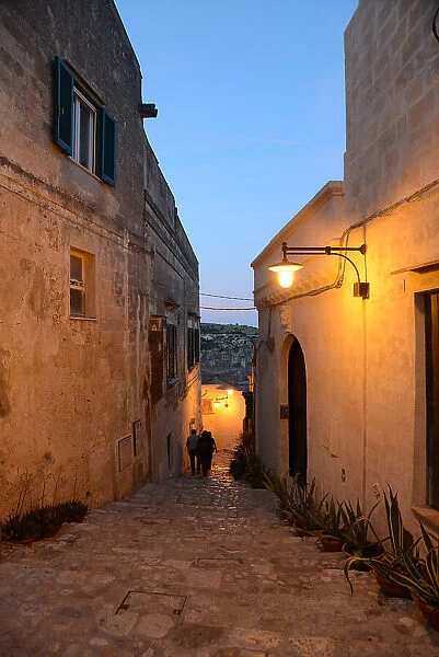 At night suggestive lights with a view over Matera. Matera is a city located on a rocky outcrop. The so-called area of the Sassi (Stones) is a complex of cave houses carved into the rock, Basilicata, Italy, Europe