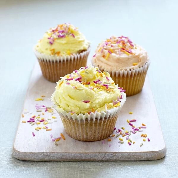 Orange lemon cupcakes with colourful sprinkles