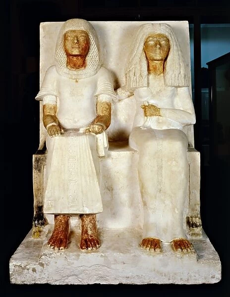 Painted limestone group statue of Meryre and his wife Iniva from New Kingdom