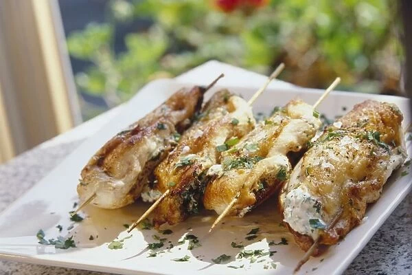 Pan-roast chicken with herbed goats cheese on skewers