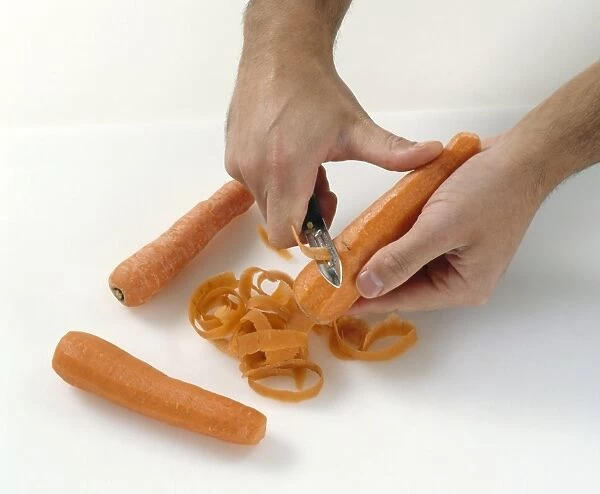 Peeling a carrot with a vegetable peeler
