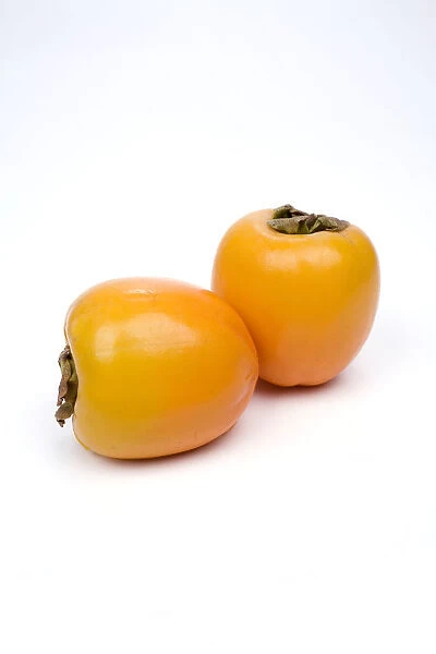 Persimmons on white background