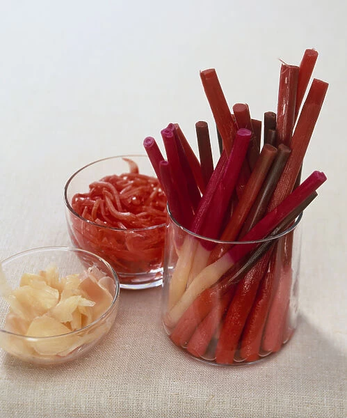 Pickled ginger in the form of shoots (hajikami shoga), strips (beni shoga), and sliced, close-up