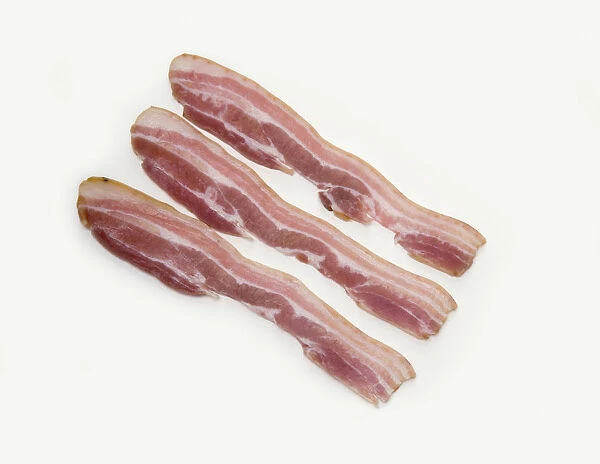 Three pieces of smoked streaky bacon, close-up