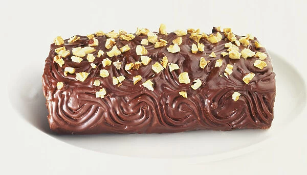 Piskota, Hungarian coffee and rum roulade, covered with plain chocolate and walnut pieces