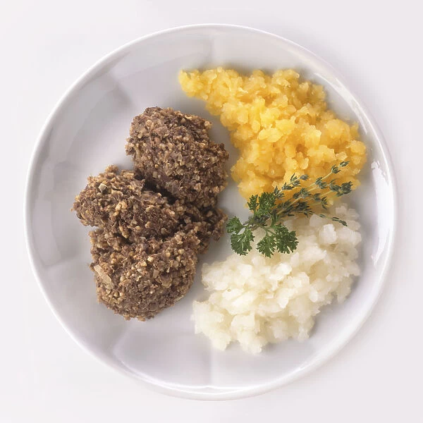 Plate of Haggis with mashed swedes and mashed potatoes, a typical Scottish dish, view from above