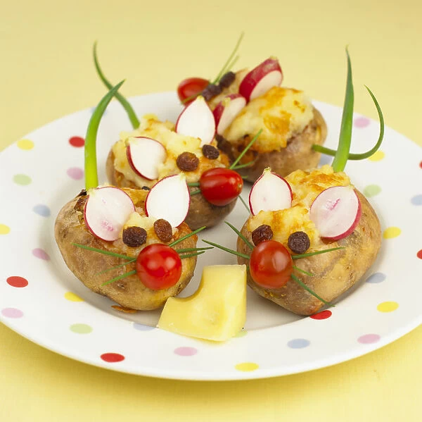 Plate of jacket potatoes decorated as mice