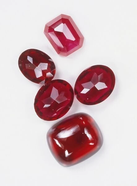 Five polished ruby gemstones