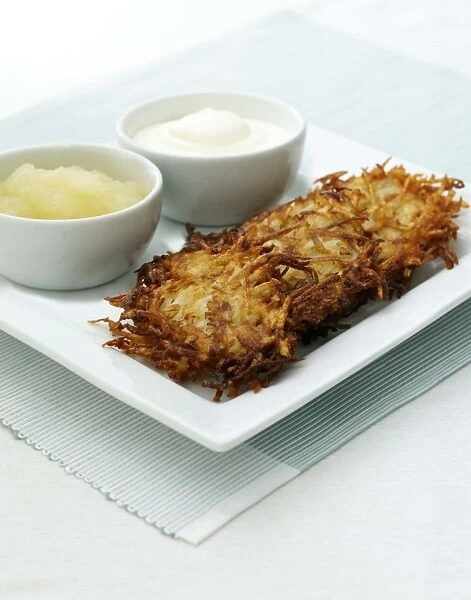potato pancakes or latkes served with apple and sour cream