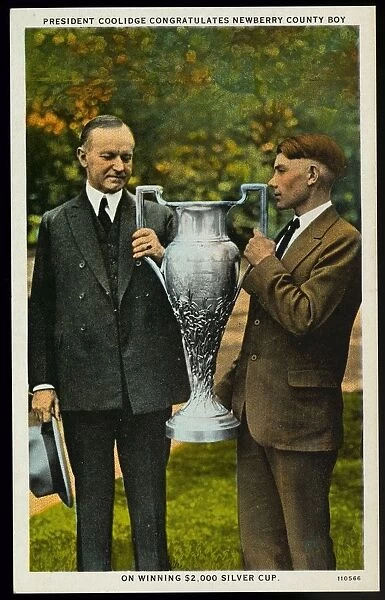 President Coolidge with Silver Cup Winner. ca. 1926, Newberry County, South Carolina, USA, Willie Pat Boland of Newberry County, South Carolina, receiving the congratulations of the President of the United States for winning the $2, 000 silver cup, offered by the Southern Railway, for the best ten ears of corn grown in the South