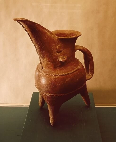 Red ceramic tripod jug from Weifang, China, 3rd millennium B. C
