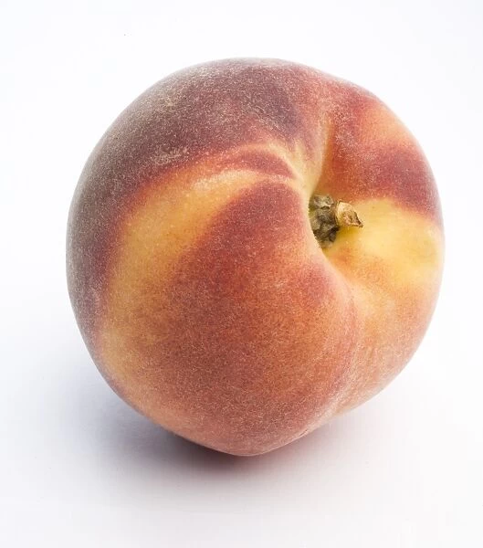 Red Haven peach on white background, close-up