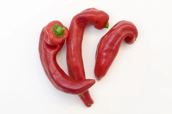 Three red Romano peppers