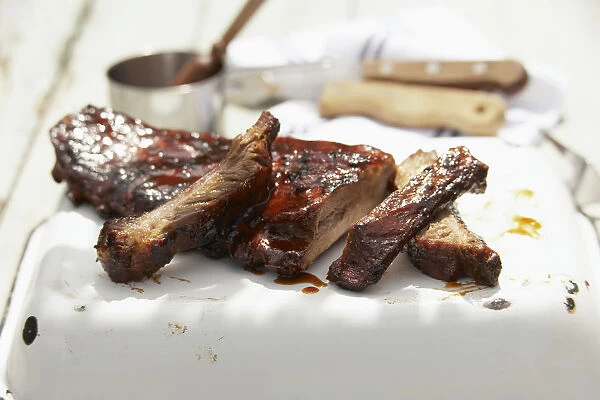 Ribs cut from beef, coated in barbecue sauce, close-up