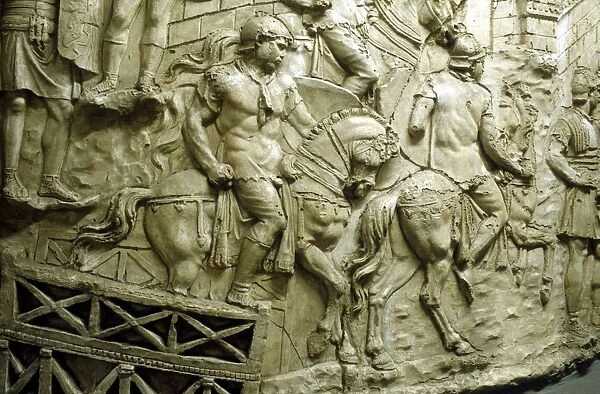 Roman cavalry crossing a wooden bridge: from Trajans column. Erected by emperor Trajan 106-113