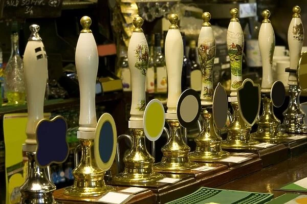 Row of beer taps in pub