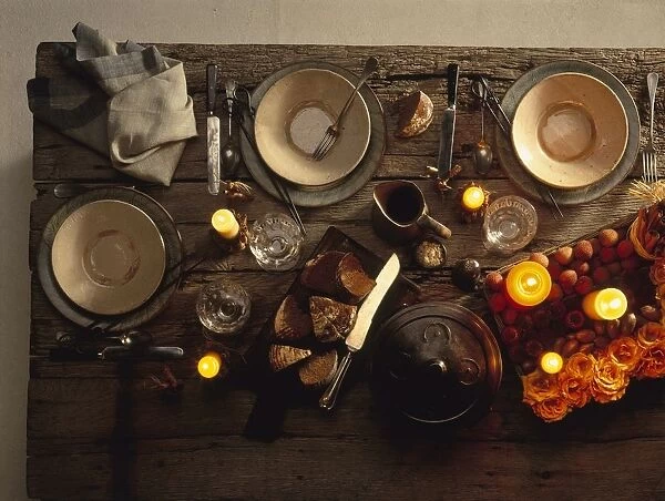 Rustic table set for candlelit dinner