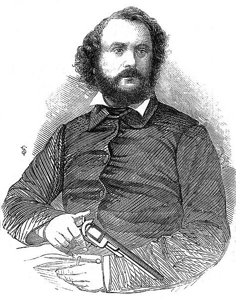 Samuel Colt (1814-1862), American inventor and industrialist, shown here with the Colt revolver
