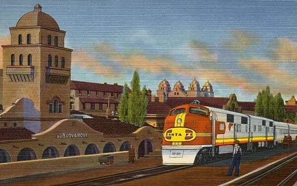 Santa Fe Train at Albuquerque Depot. ca. 1939, Albuquerque, New Mexico, USA, A-27 SANTA FE SUPER CHIEF AT ALBUQUERQUE, NEW MEXICO. A crack streamlined train of the Santa Fe Ry. in front of the Depot and Alvarado Hotel, ready to continue its journey from Chicago to Los Angeles