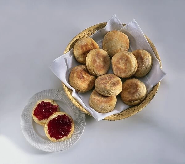 Scones in a basket, and sliced and topped with jam on a plate