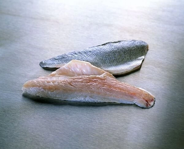 Sea bass fillets on kitchen worktop, close-up