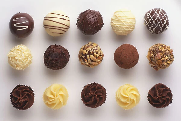 Selection of chocolate truffles filled with nuts, fruit and liqueur, close up