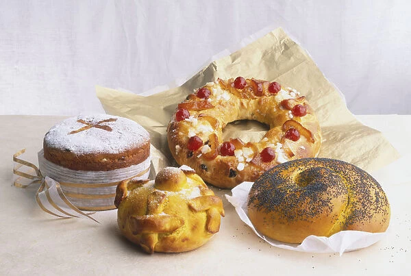 A selection of festive breads including Panettone; Pan de Muerto; Bolo-Rei; and Challah