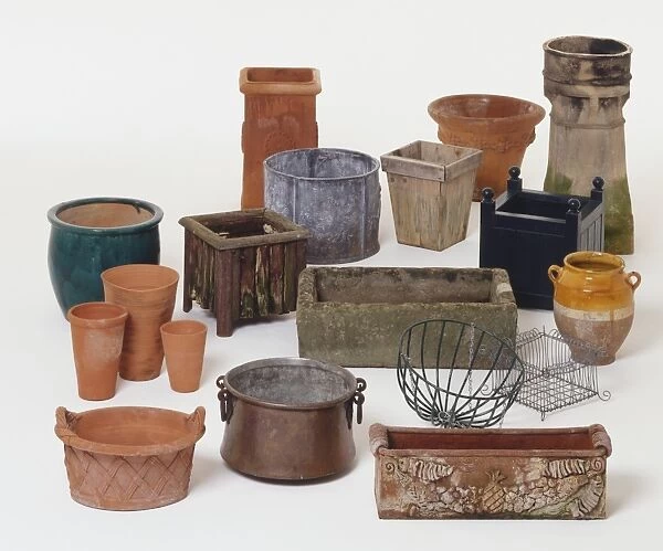 Selection of gardening containers made from clay, stone, wood, fibreglass and metal
