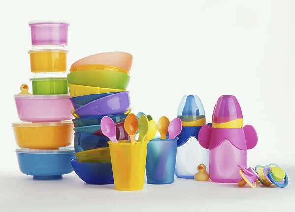 Selection of multi-coloured baby food containers, bottles, cups, spoons and pacifiers