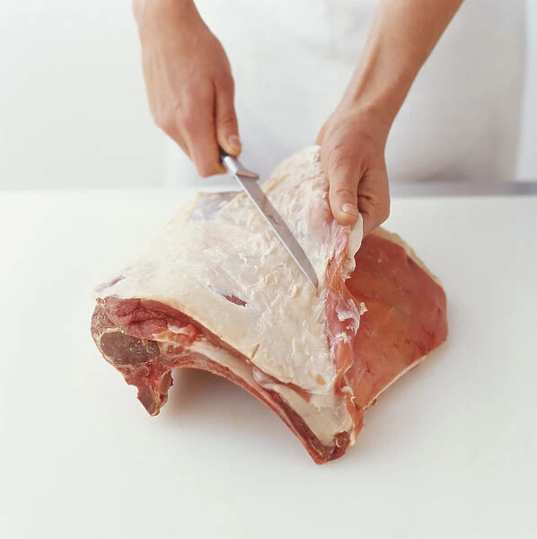 Separating meat and fat from a rib of beef