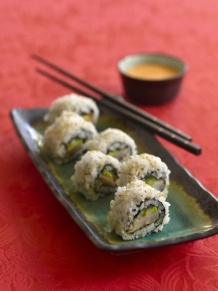 Shrimp and avocado sushi with sriracha mayonnaise, chopsticks