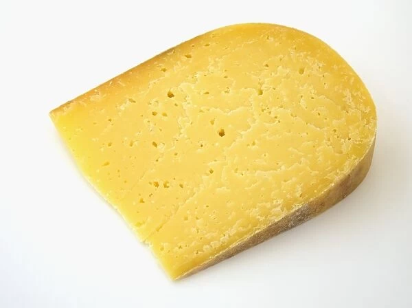Slice of American Winchester Suger Aged Gouda cows milk cheese