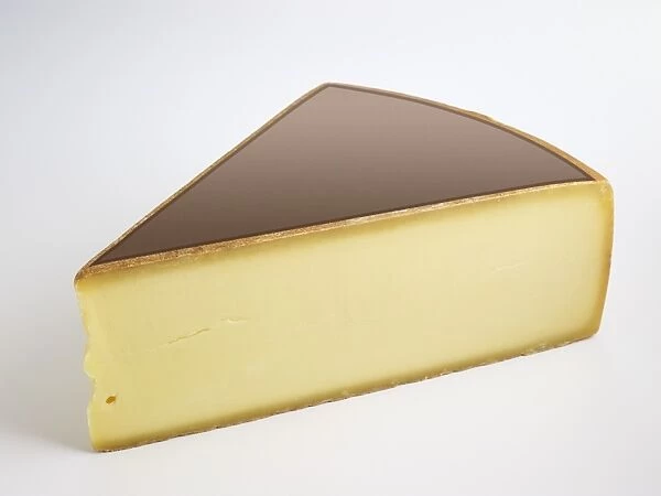 Slice of German Allgauer Bergkase cows milk cheese