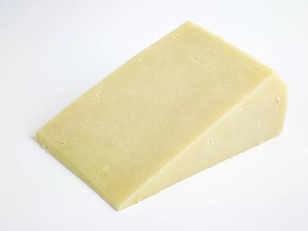 Slice of Greek Kaseri DOC goat and ewes milk cheese