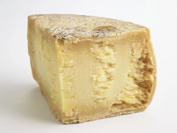 Slice of Italian Pecorino Siciliano PDO sheeps milk cheese