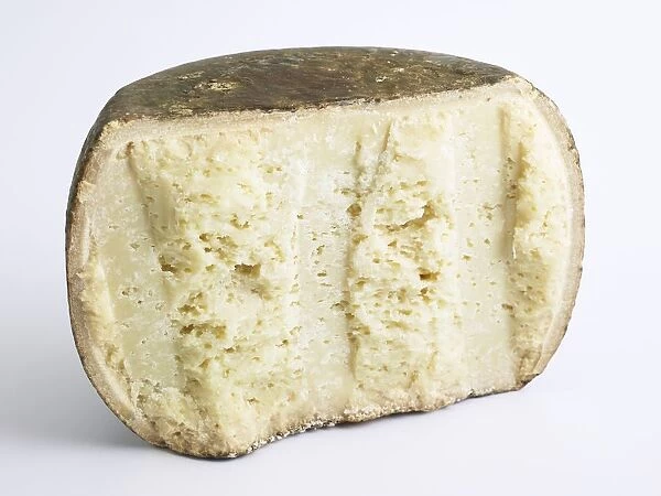 Sliced drum of Italian Fiore Sardo PDO Ewes milk cheese