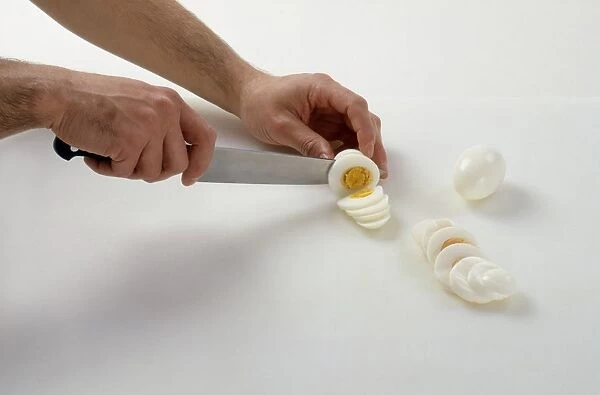 Slicing boiled eggs with a chefs knife