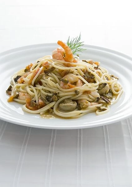 Spaghetti with seafood on plate, close-up