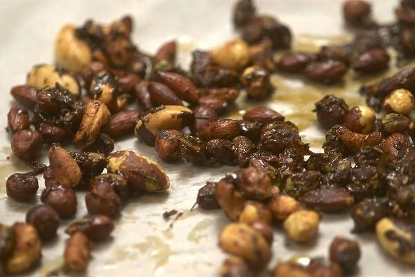 Spiced nuts cooling on greaseproof paper