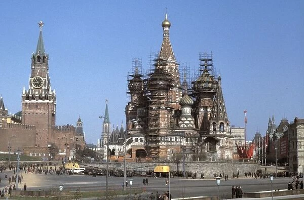 St, basils cathedral under renovation in red square with the moscow kremlin on the left, 1980s