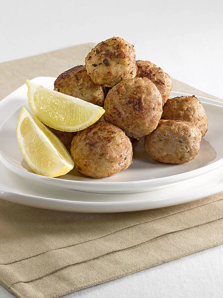 Stack of Swedish meatballs on plate, close-up