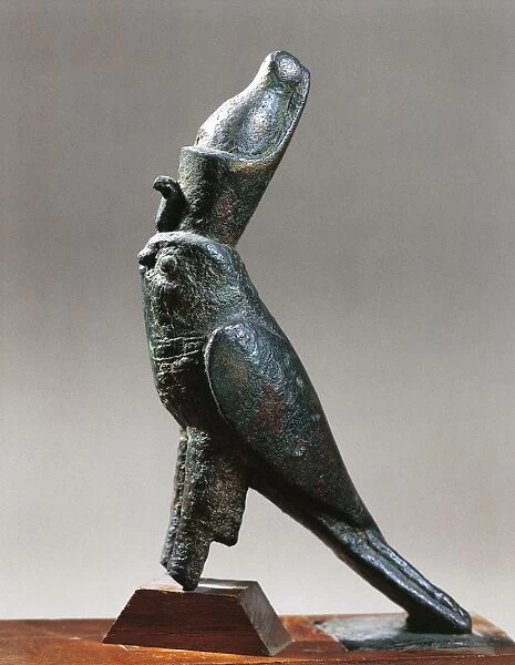Statuette representing the Falcon god, Horus wearing the double crown, bronze