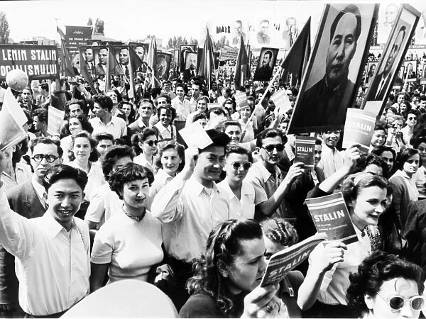 Students with maos portrait in the may day demonstration in bucharest, in 1952