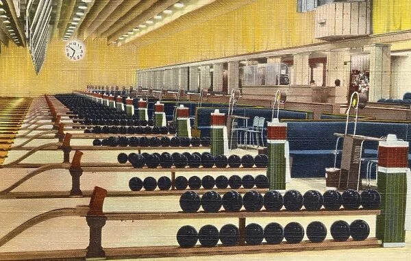 Sunset Bowling Center. ca. 1945, Hollywood, Los Angeles, California, USA, Hollywood, CA. An impressive spectacle of unequalled color is offered by a view of the 26 ball racks and the chalk boxes which stand at attention at the head of Sunset Bowling Centers 52 lanes. Balls and equipment were selected only from the very finest stock. Sunset Center is located on the Warner Bros. lot where Hollywoods first talking picture was made