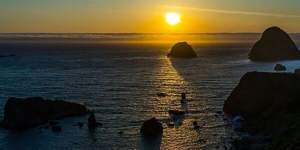 Sunset of sea stacks of rocks Oregon Coast line